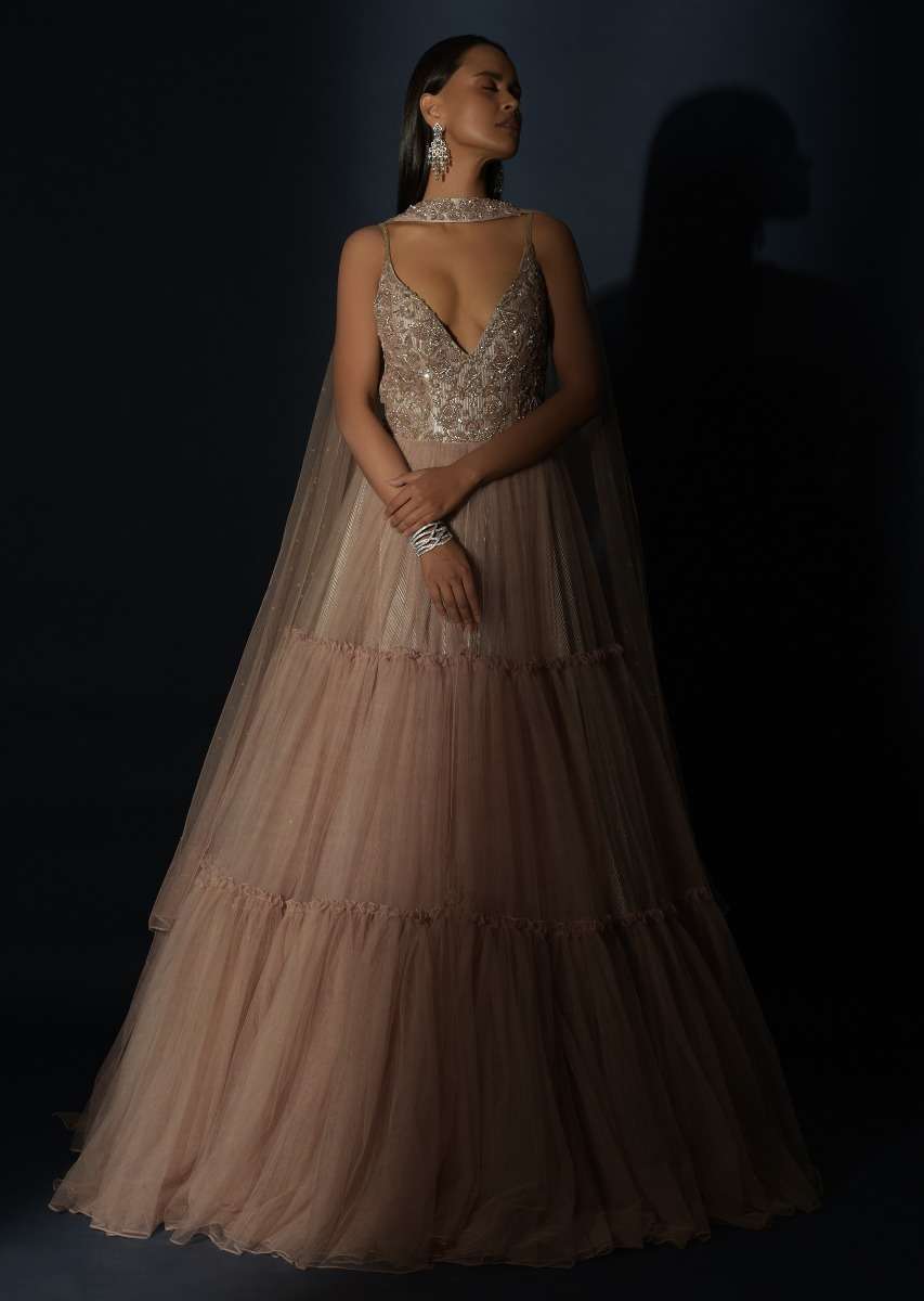 Champagne Tiered Gown With An Embellished Plunging V Cut Bodice And Shimmer Underlayer