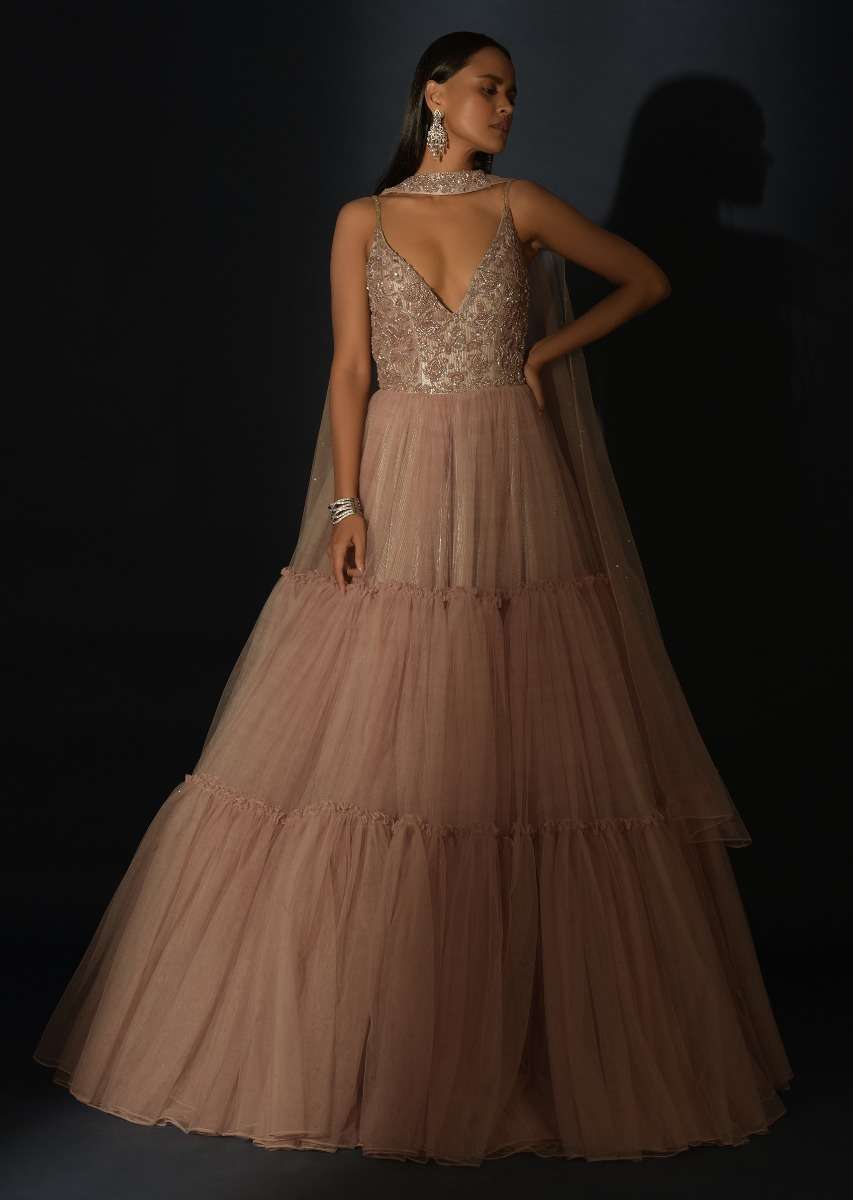 Champagne Tiered Gown With An Embellished Plunging V Cut Bodice And Shimmer Underlayer