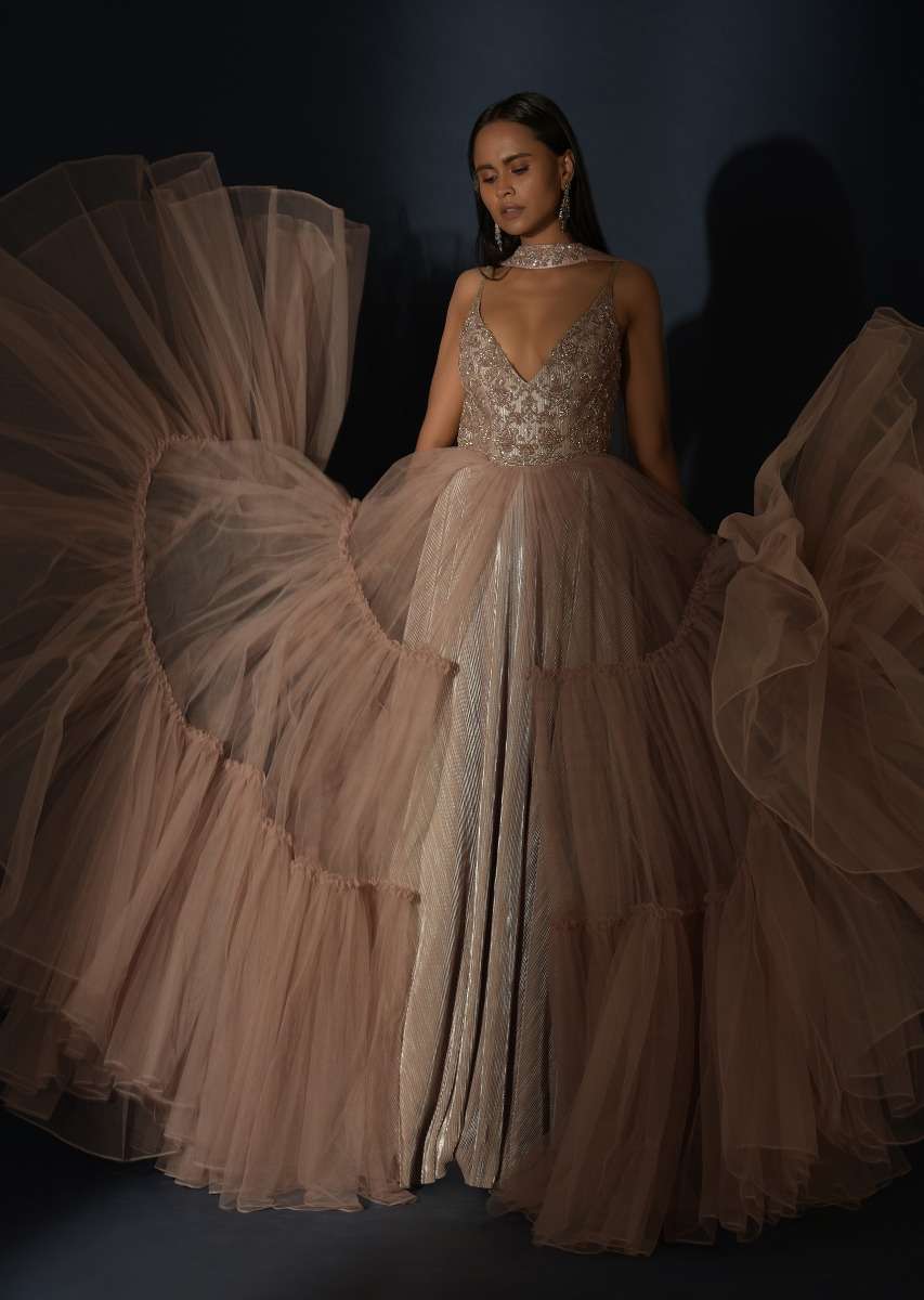 Champagne Tiered Gown With An Embellished Plunging V Cut Bodice And Shimmer Underlayer