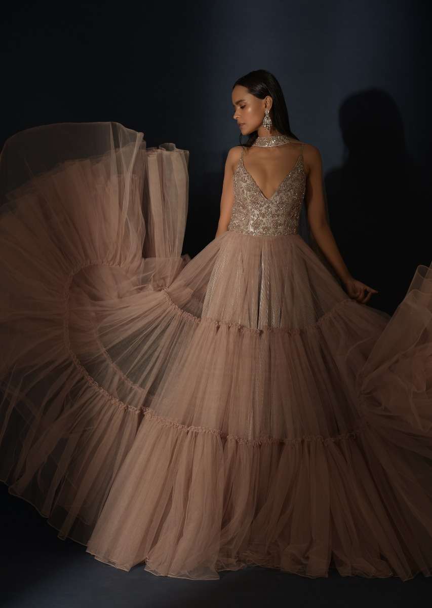 Champagne Tiered Gown With An Embellished Plunging V Cut Bodice And Shimmer Underlayer