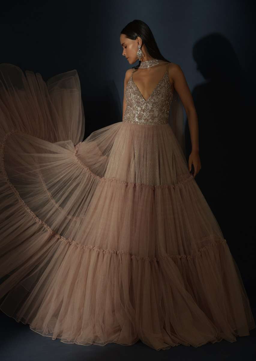 Champagne Tiered Gown With An Embellished Plunging V Cut Bodice And Shimmer Underlayer