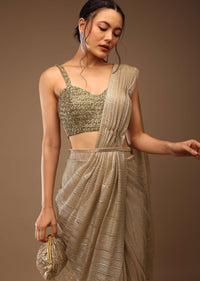 Champagne Beige Ready-Pleated Saree With A Crop Top In Stones Embellishment