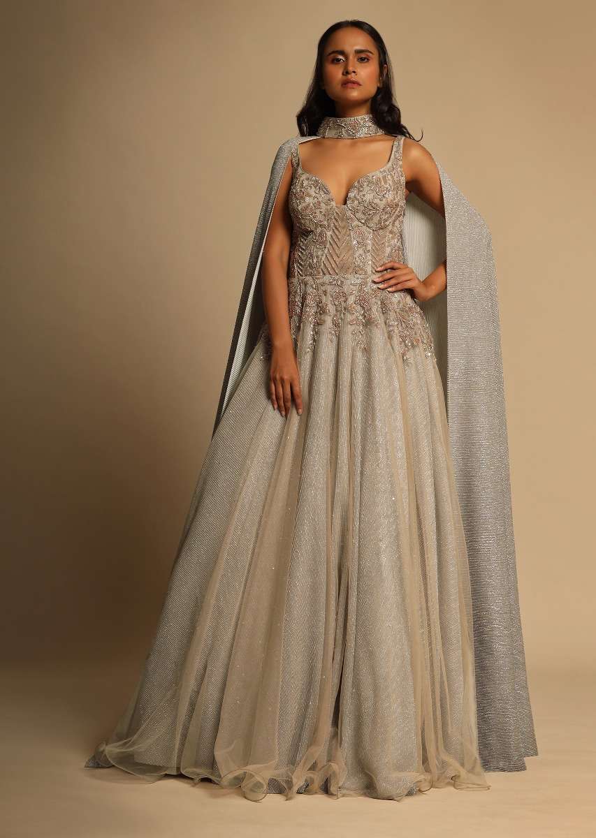 Champagne Embellished Gown With Plunging Neckline And A Fancy Choker With Attached Cape