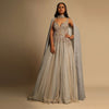 Champagne Embellished Gown With Plunging Neckline And A Fancy Choker With Attached Cape