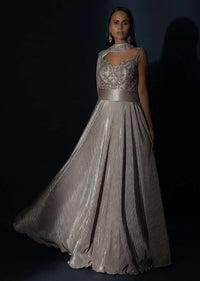 Champagne Gown In Crushed Shimmer With An Embellished Bodice Highlighting The Waistline And Fancy Cape