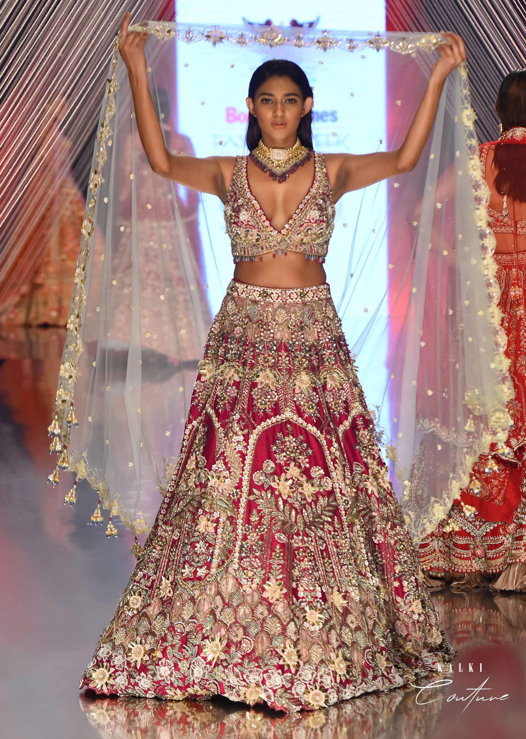 Cherry Red Royal Heritage Lehenga And A Choli Set In 3D Petal Motifs Embroidery, Organza Multi Color Dupatta In Zari Work Embroidery Buttis