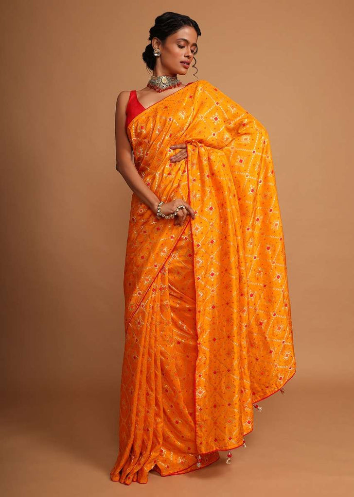 Chrome yellow bandhani printed dola silk saree with weaved work Online - Kalki Fashion