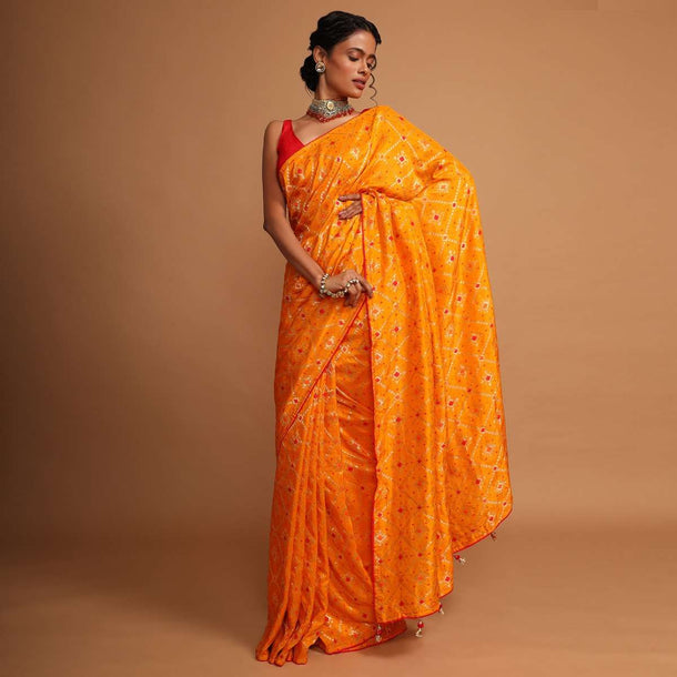 Chrome yellow bandhani printed dola silk saree with weaved work Online - Kalki Fashion