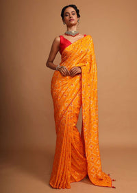 Chrome yellow bandhani printed dola silk saree with weaved work Online - Kalki Fashion