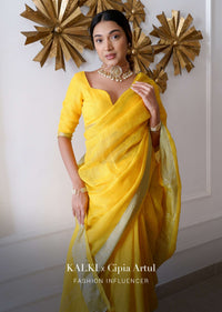 Sun Yellow Saree In Linen With Silver Brocade Border And Striped Pallu Along With A Matching Unstitched Blouse