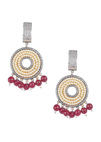 Circular grey and gold danglers embellished with pearls, stones and burgundy beads only on Kalki