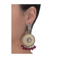 Circular grey and gold danglers embellished with pearls, stones and burgundy beads only on Kalki