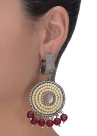 Circular grey and gold danglers embellished with pearls, stones and burgundy beads only on Kalki