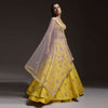 Citrus Lehenga Choli In Raw Silk With Resham Embroidered Spring Blooms And Gradating Floral Buttis