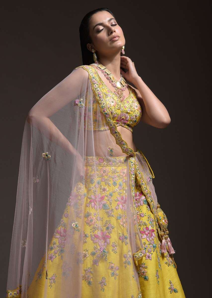 Citrus Lehenga Choli In Raw Silk With Resham Embroidered Spring Blooms And Gradating Floral Buttis