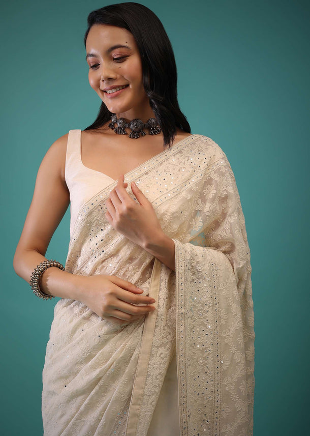 Cloud Cream Saree In Lucknowi Threadwork In A Moroccan Jaal, Mirror Abla And Cut Dana Detailing Work On The Pallu