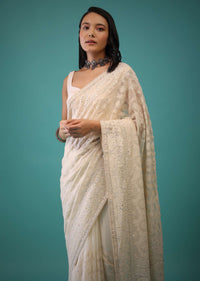 Cloud Cream Saree In Lucknowi Threadwork In A Moroccan Jaal, Mirror Abla And Cut Dana Detailing Work On The Pallu