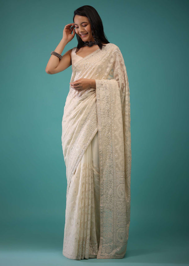 Cloud Cream Saree In Lucknowi Threadwork In A Moroccan Jaal, Mirror Abla And Cut Dana Detailing Work On The Pallu