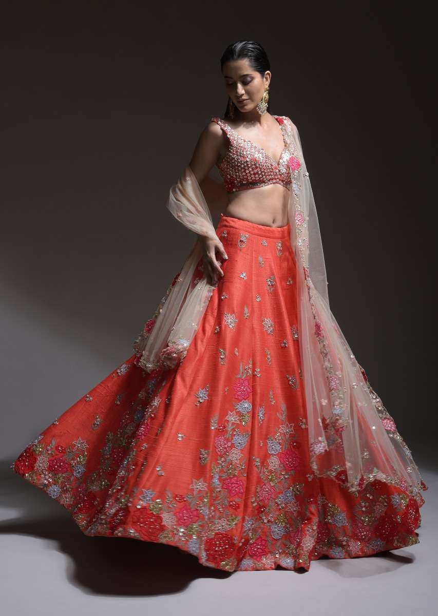 Coral Lehenga Choli With Resham Embroidered Summer Blossoms Along The Hemline And Scattered Buttis