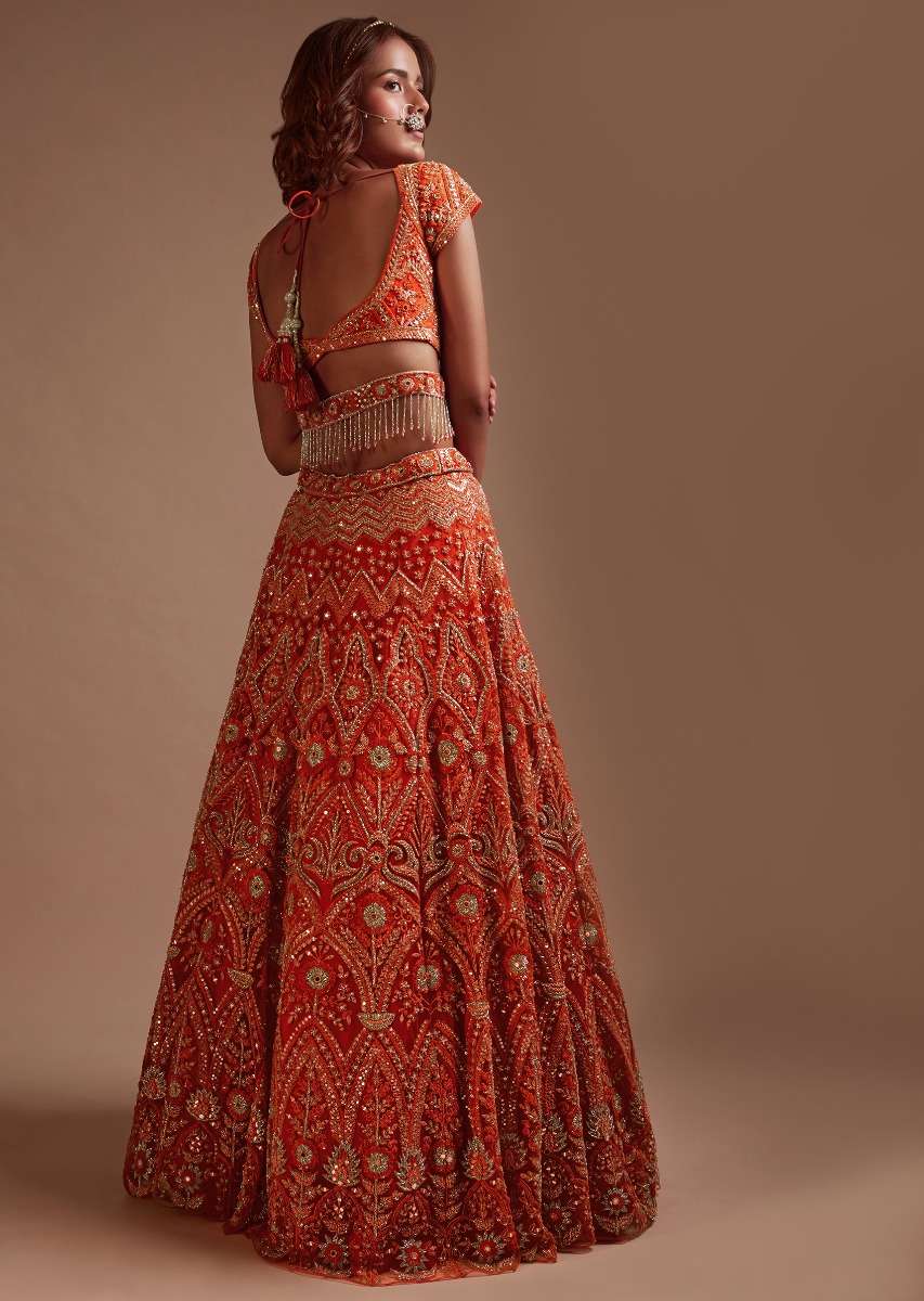 Coral Orange Lehenga Choli In Net With Mirror And Sequins Embroidered Floral And Mughal Embroidery Along With Belt Detailing