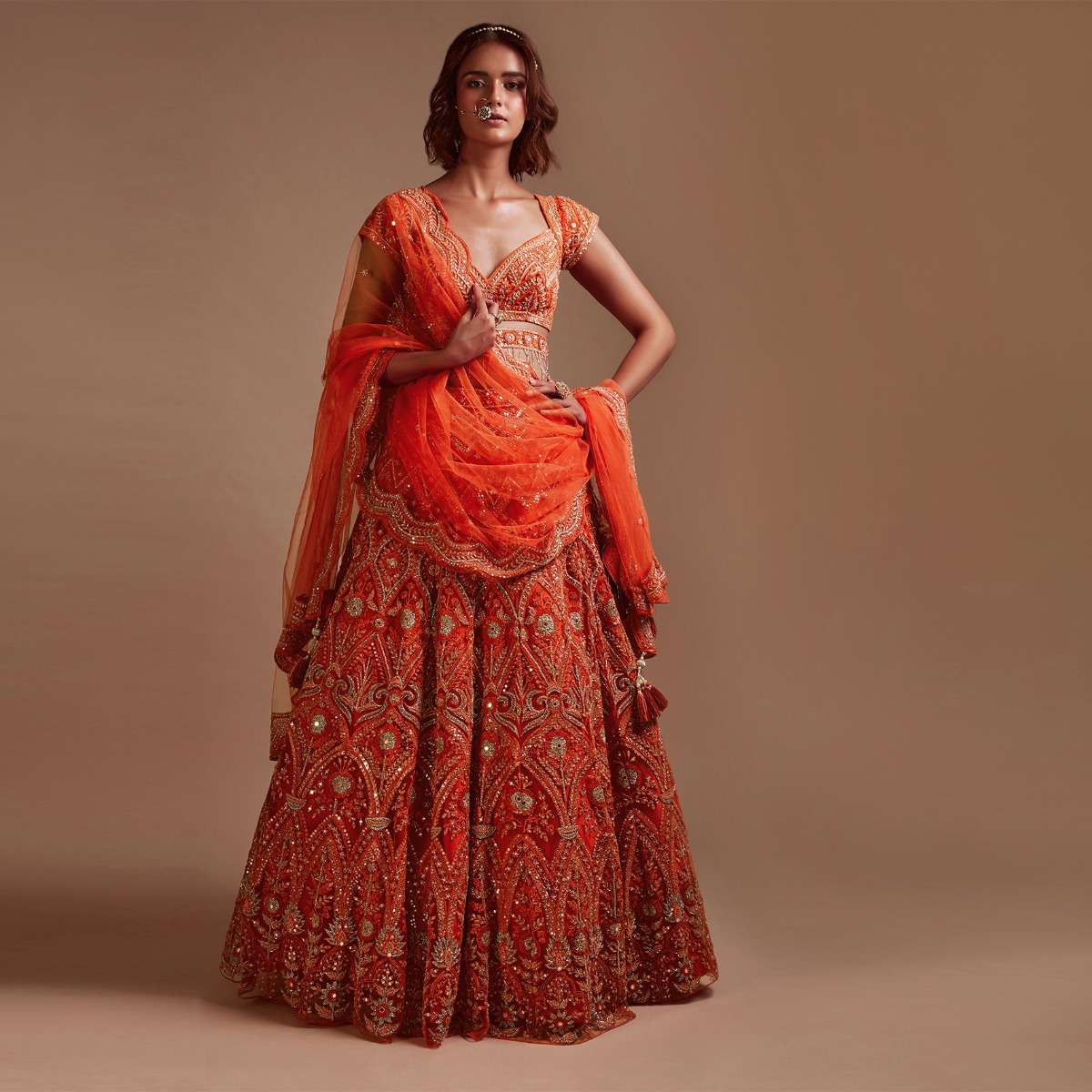 Coral Orange Lehenga Choli In Net With Mirror And Sequins Embroidered Floral And Mughal Embroidery Along With Belt Detailing