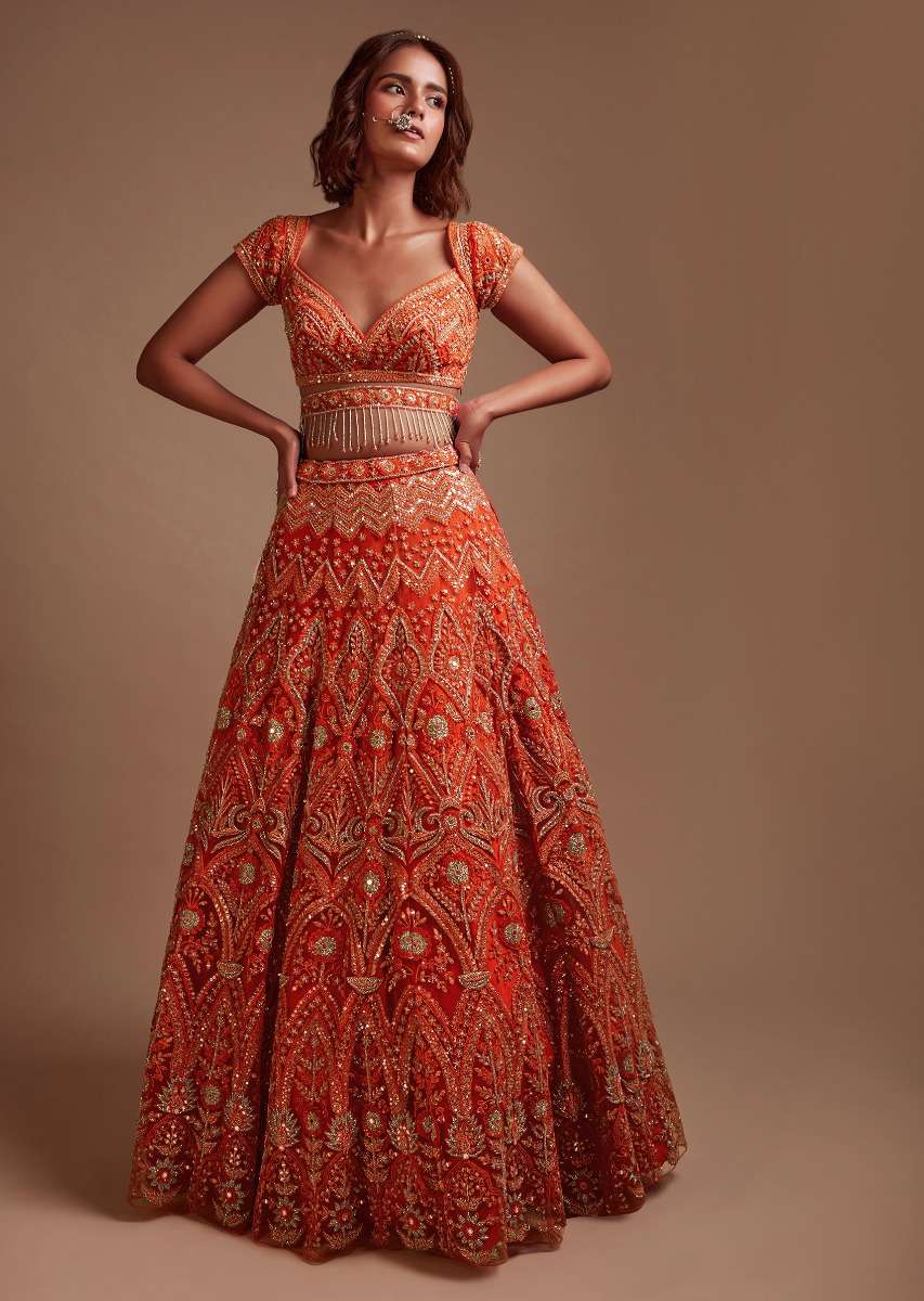 Coral Orange Lehenga Choli In Net With Mirror And Sequins Embroidered Floral And Mughal Embroidery Along With Belt Detailing