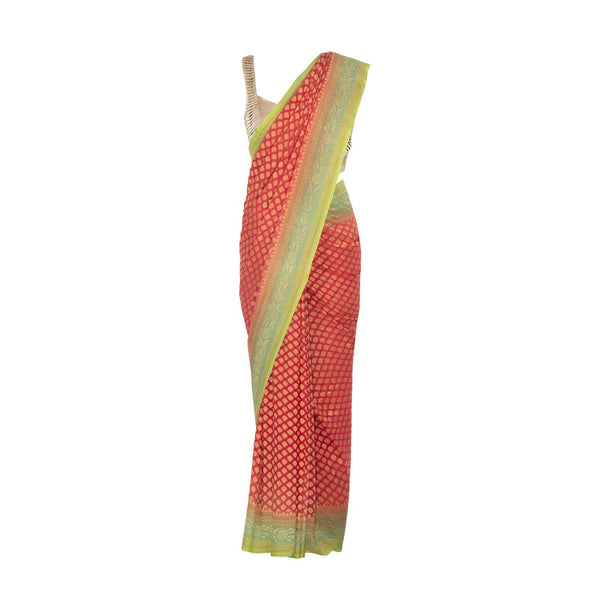 Coral peach saree in georgette embellished in weaved butti all over