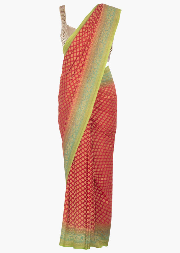 Coral peach saree in georgette embellished in weaved butti all over