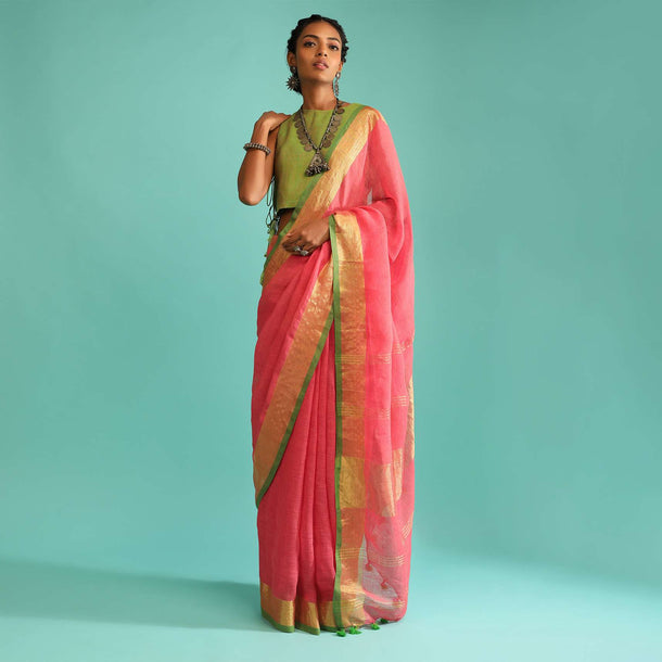 Coral Peach Saree In Linen With Golden Brocade Border And Striped Pallu Along With Green Unstitched Blouse Online - Kalki Fashion