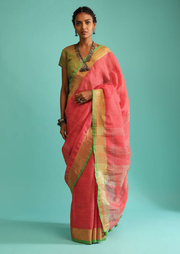 Coral Pink Saree In Linen With Golden Brocade Border And Striped Pallu