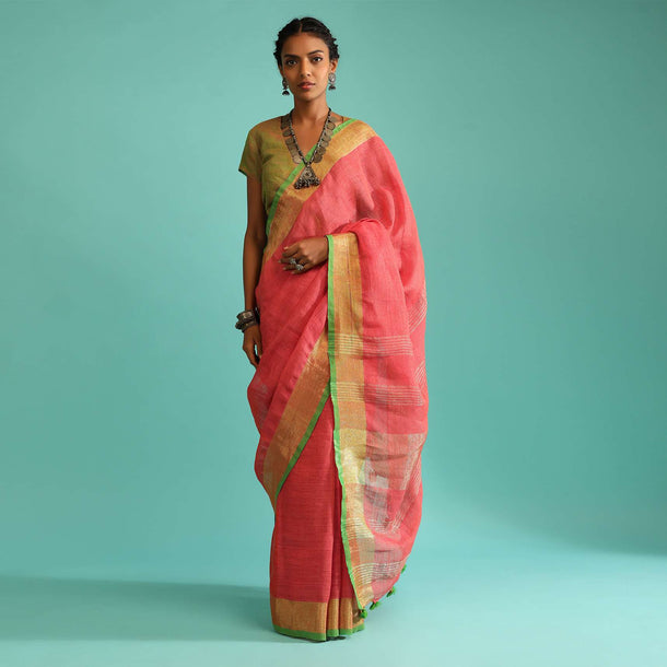 Coral Pink Saree In Linen With Golden Brocade Border And Striped Pallu