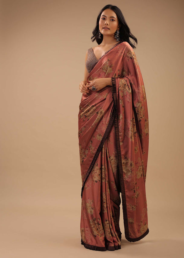 Coral Peach Saree With Brown Frill Borders And Floral Print