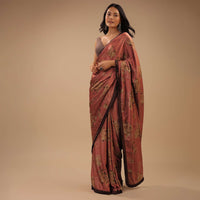 Coral Peach Saree With Brown Frill Borders And Floral Print