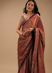 Coral Peach Saree With Brown Frill Borders And Floral Print