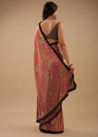 Coral Peach Saree With Brown Frill Borders And Floral Print