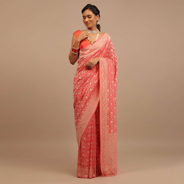 Coral Pink Saree In A Traditional Silhouette In Georgette With Floral Jaal Work