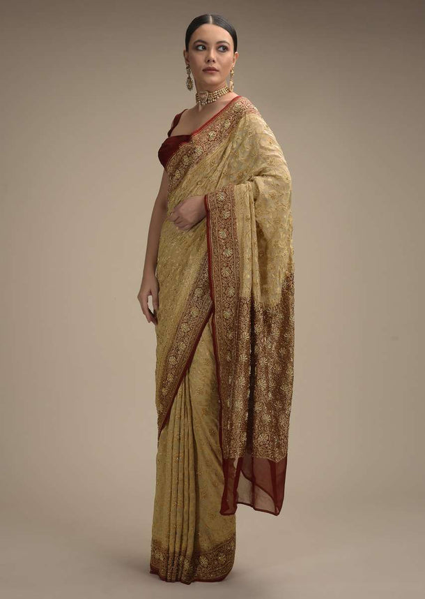 Cream Banarasi Saree In Georgette With Woven Floral Jaal And Maroon Border Along With Stone Accents Online - Kalki Fashion