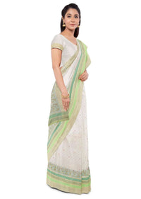 Cream banarasi saree with green floral printed border only on Kalki