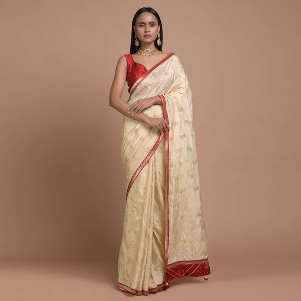 Cream Beige Saree In Dola Silk With Brocade Floral Buttis And Red Bandhani Design On The Pallu Online - Kalki Fashion