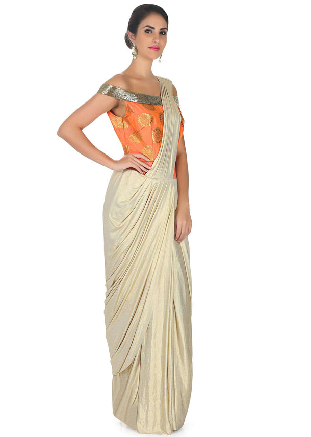 Cream foil saree gown with orange brocade bodice only on Kalki