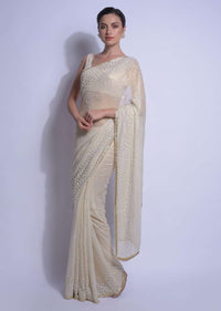 Cream Gold Saree In Shimmer Georgette With Embellished  Floral Buttis Online - Kalki Fashion