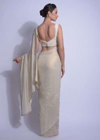 Cream Gold Saree In Shimmer Georgette With Embellished  Floral Buttis Online - Kalki Fashion