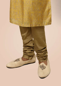 Light Beige Juttis In Suede With Zari Embroidered Motif