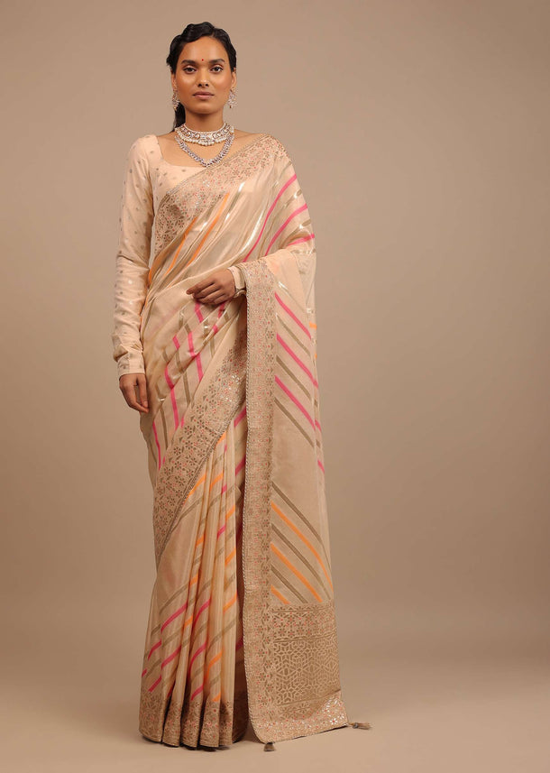 Cream Saree In Dola Silk With Multi Colored Woven Diagonal Stripes And Floral Border