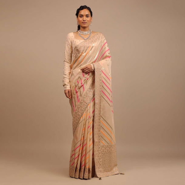 Cream Saree In Dola Silk With Multi Colored Woven Diagonal Stripes And Floral Border