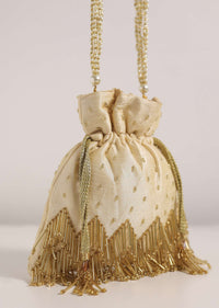 Cream White Potli Bag With Tassels And A Handworked Handle