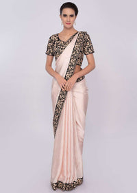 Creamish peach satin silk saree with dark navy blue velvet blouse only on Kalki