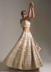 Creamy Pink Lehenga Choli In Raw Silk With Pink Resham And Zardosi Embroidered Floral Kalis Online - Kalki Fashion