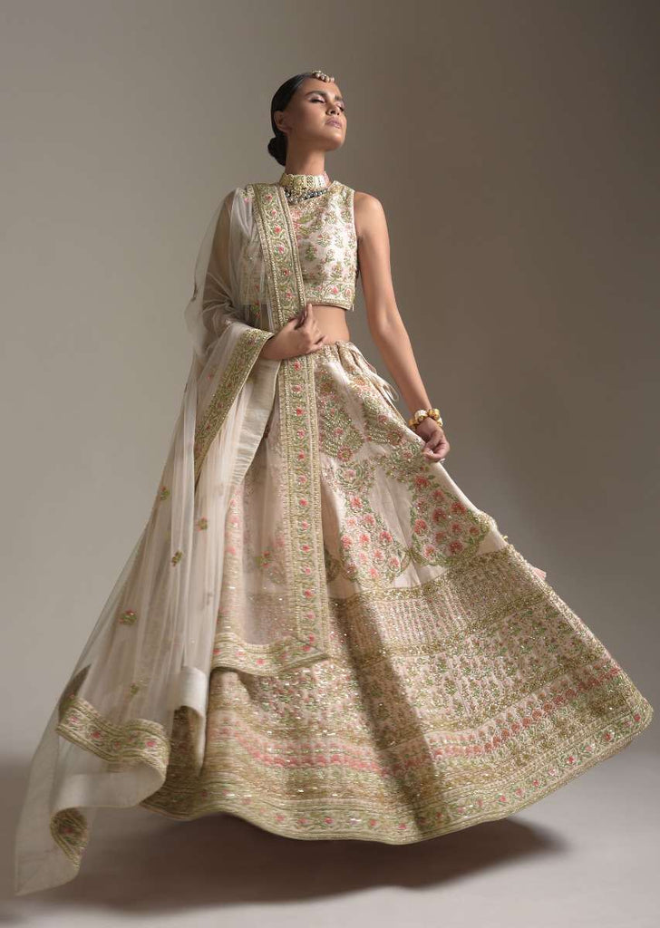 Creamy Pink Lehenga Choli In Raw Silk With Pink Resham And Zardosi Embroidered Floral Kalis Online - Kalki Fashion