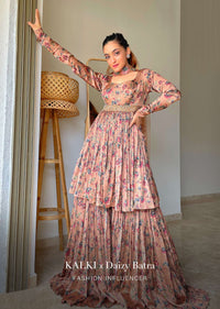 Dusty Peach Sharara Suit In Satin With A Front Slit Peplum Kurti And Moti Accented Waistline